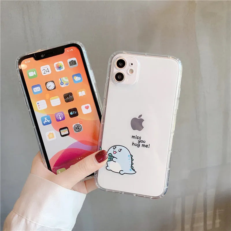 Clear transparent iPhone case with green dinosaur design showing phone protection