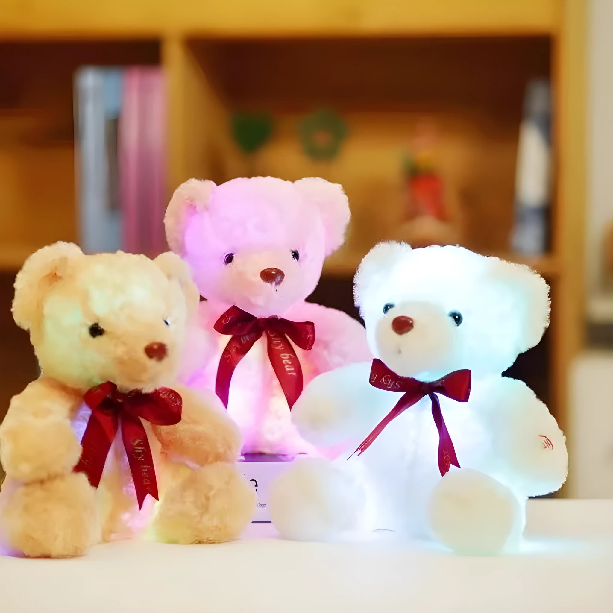 Plush teddy bear with glow feature in brown colour, sitting at 25 cm height