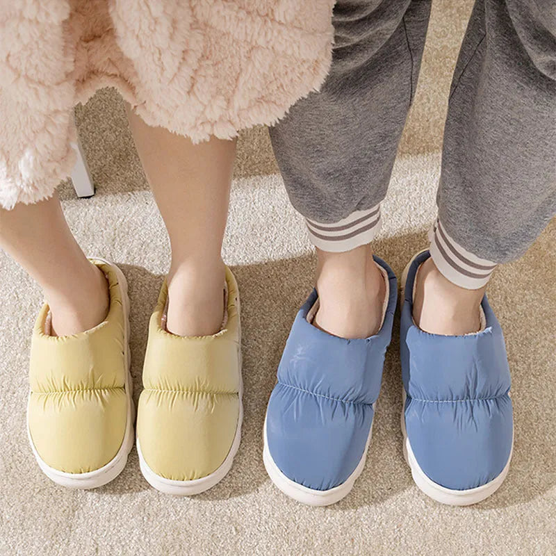 A pair of thick-soled down cotton slippers for men and women in a choice of colours, featuring a non-slip rubber sole.