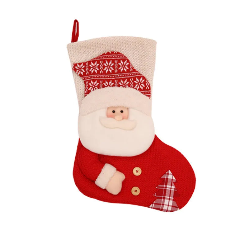 Large red and white knitted Christmas stocking with Santa Claus design hanging on fireplace
