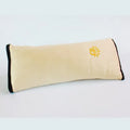 Children car pillow in grey micro-suede fabric attached to a car seat belt shoulder strap