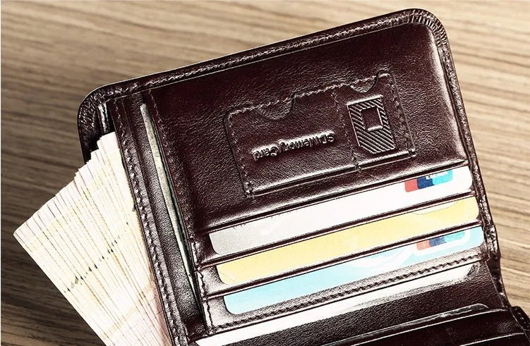 Men's black leather wallet open to show internal card slots, coin pocket, and banknote compartment.