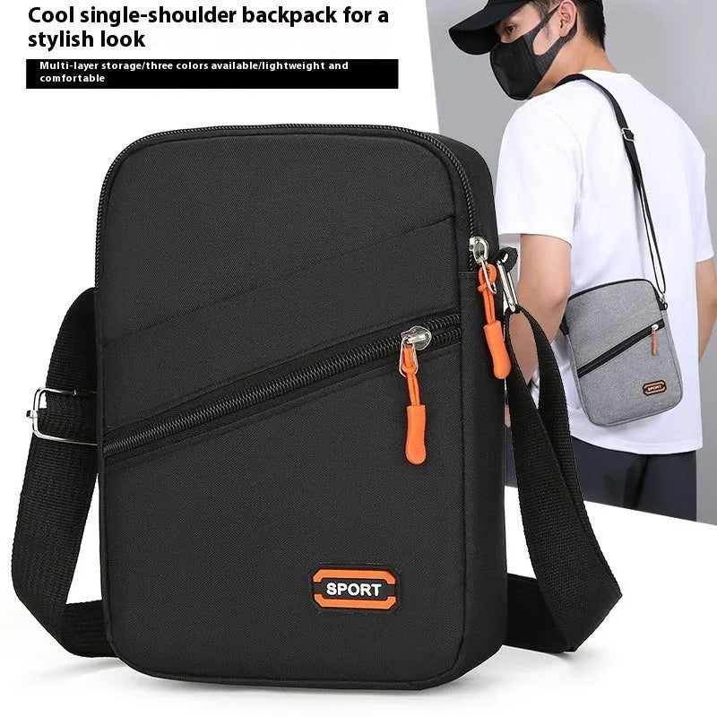 Solid colour Oxford cloth commuter bag with contrast stitching, shown with crossbody strap.