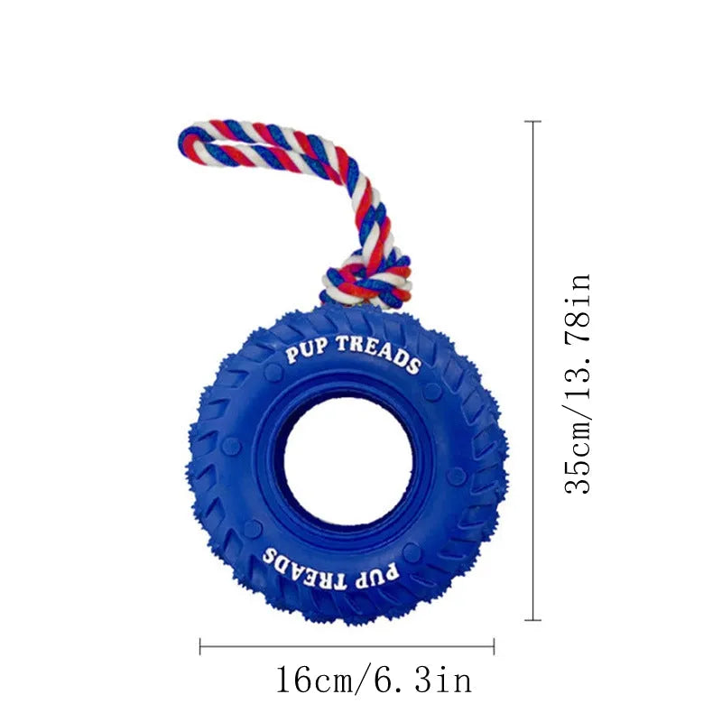 Rubber tire dog chew toy with cotton rope handle for tug of war and treat dispensing, in black, blue, or orange