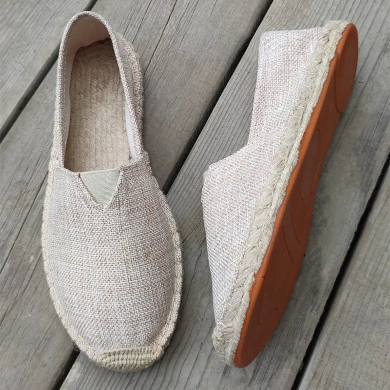 Men's solid colour canvas casual shoes with round toe in light brown.