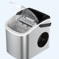 Silver countertop home ice machine with 1.2L capacity and push-button control on a kitchen counter