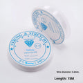 Spool of transparent white elastic cord for jewellery making on a craft table.