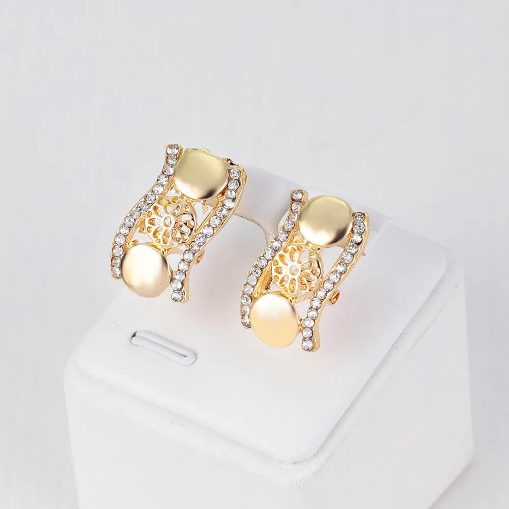 Four-piece gold tone crystal bridal jewellery set with necklace earrings bracelet and ring on display