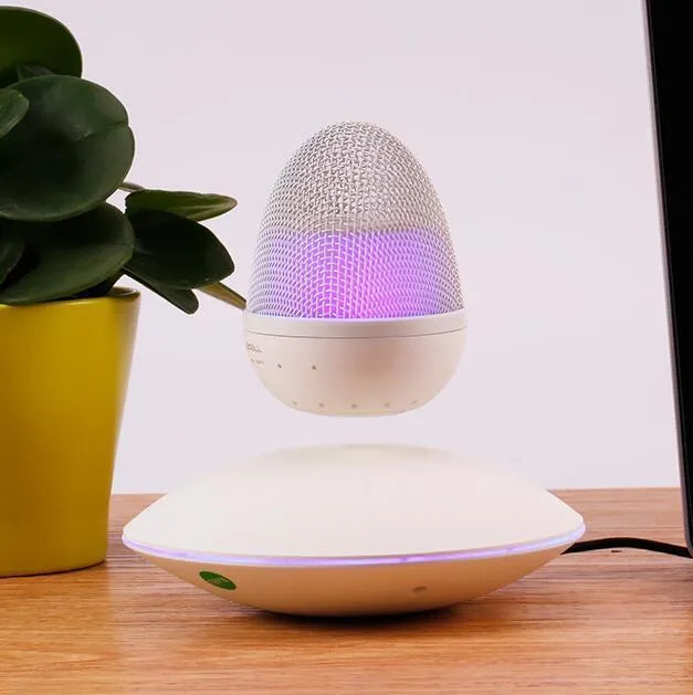 Newest levitating floating speaker in black with magnetic suspension on base showing wireless bluetooth connectivity for home decor