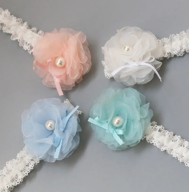 Korean children's fabric flower hairpins in pink and white on display