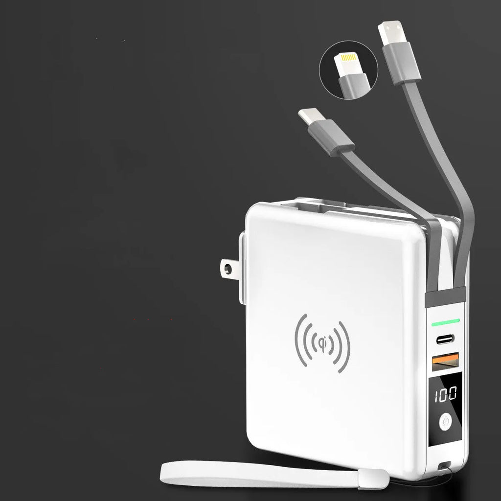 Super Qi wireless power bank in black with folding plug extended and four international adapter heads.