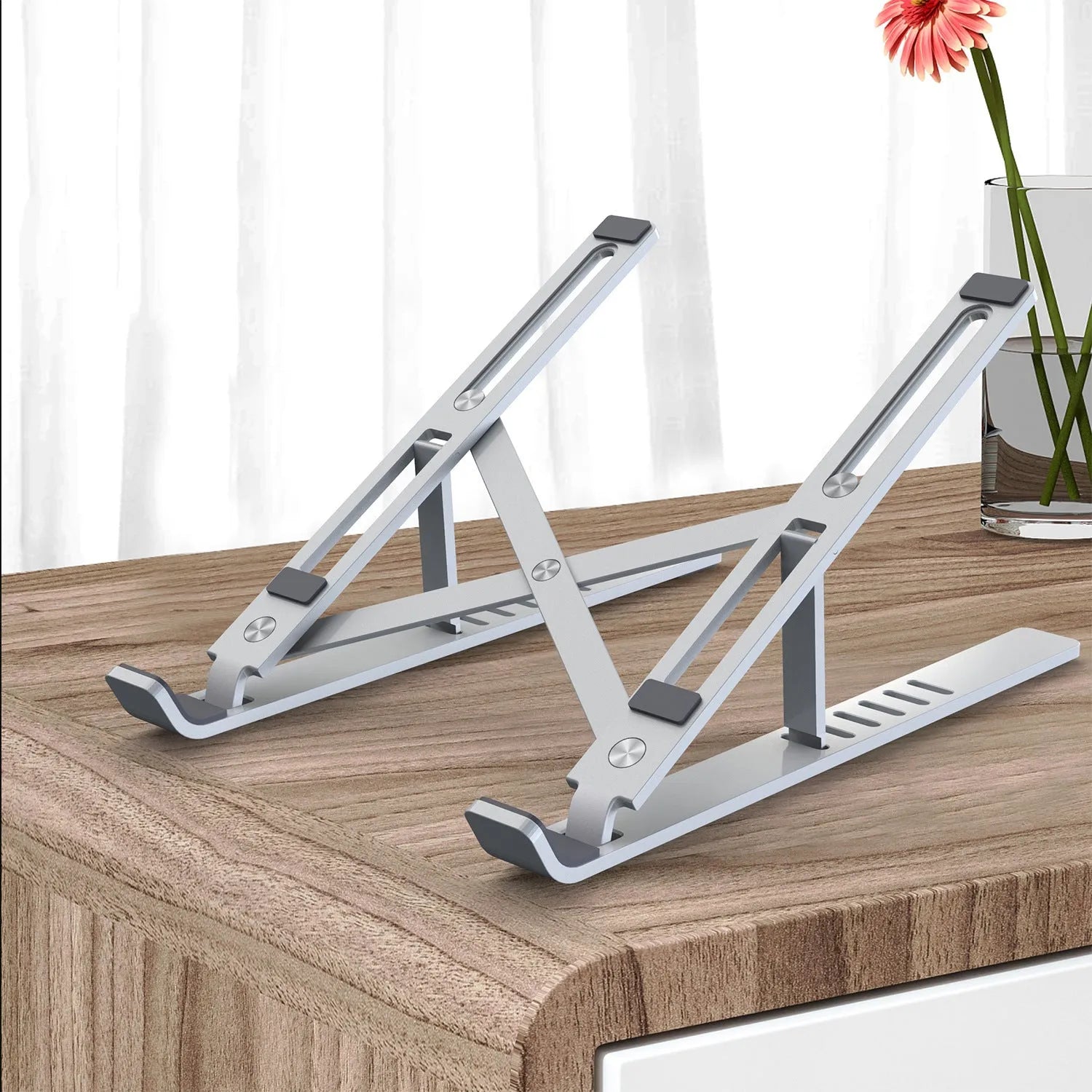 Portable aluminum alloy laptop stand in folded and extended positions showing height adjustment mechanism