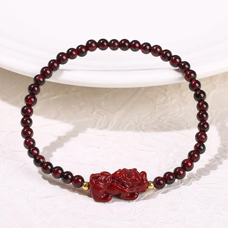Geometric square garnet bracelet with strawberry quartz and purple sand pixiu charm.