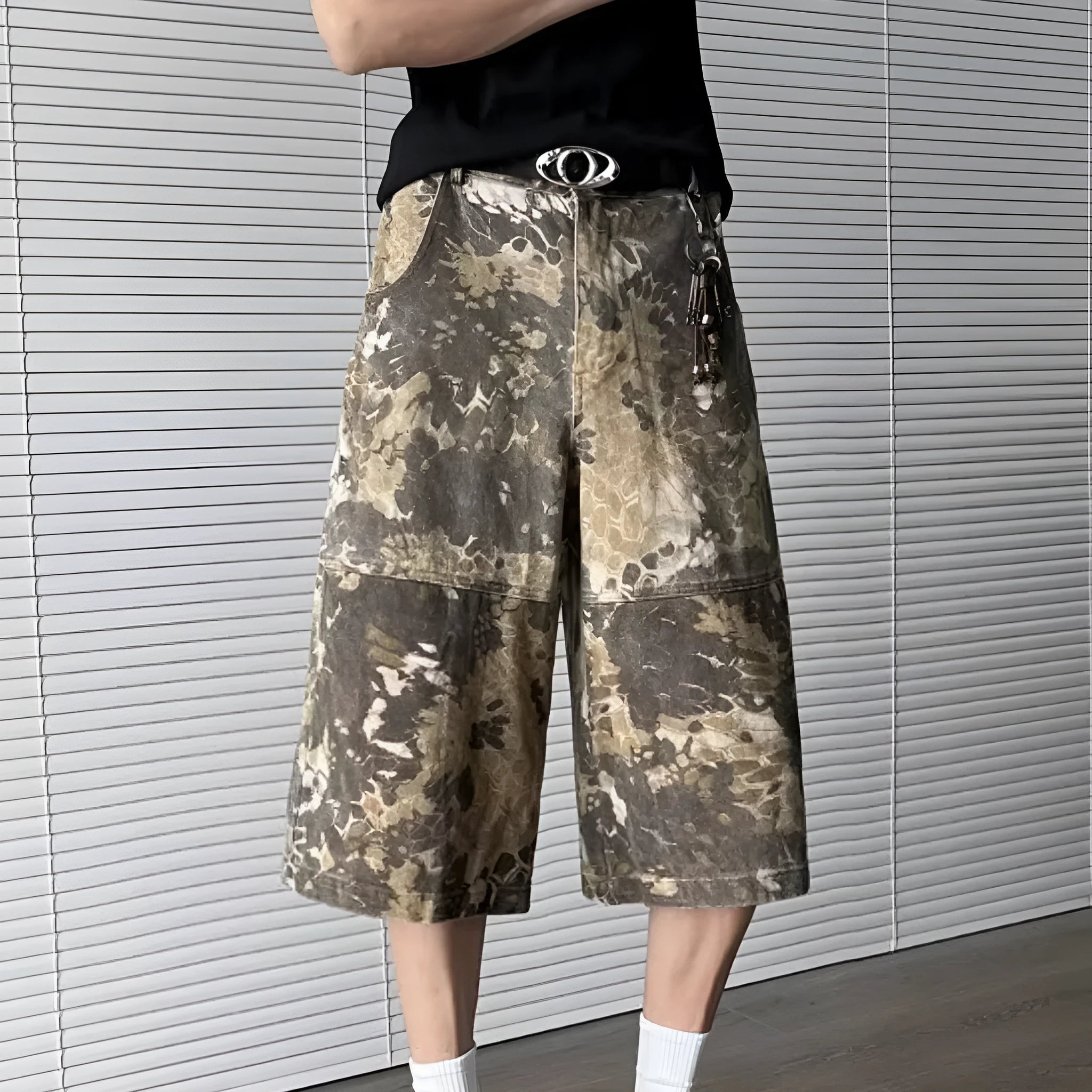 Yellow snake pattern camouflage cropped jeans on hanger showing cotton denim fabric
