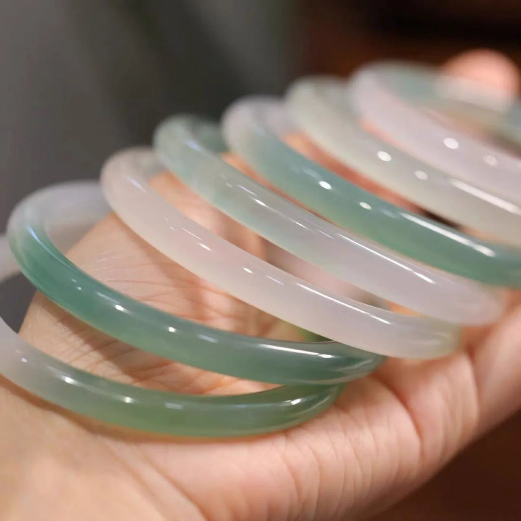 Chalcedony jade bead bracelet in semi-mountain semi-water style on wrist