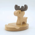 Resin and beech wood character mobile phone stand holder with designs including dog, cat, kung fu, and elephant.