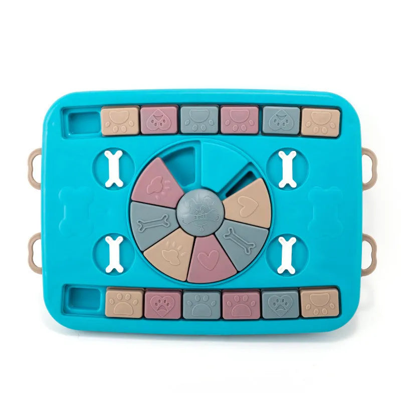 Blue plastic interactive dog puzzle feeder with sliding panel and four corner handles on a non-slip base