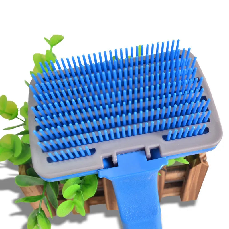 Self-cleaning pet brush comb for dogs and cats measuring 16 x 10cm with comfortable handle