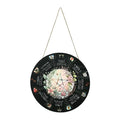 Boxwood decorative wooden pendant with choice of five carved disc designs on a neutral background.