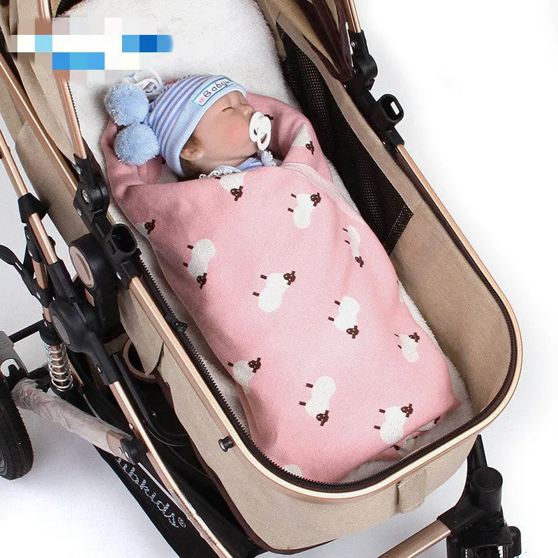 A pink 100x80 cm cotton baby blanket cover laid flat, designed to be windproof for infant cots.
