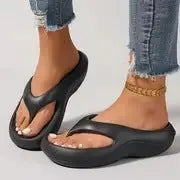 Women's thick-soled EVA flip-flops in black, white, or grey colours with non-slip and anti-odour properties