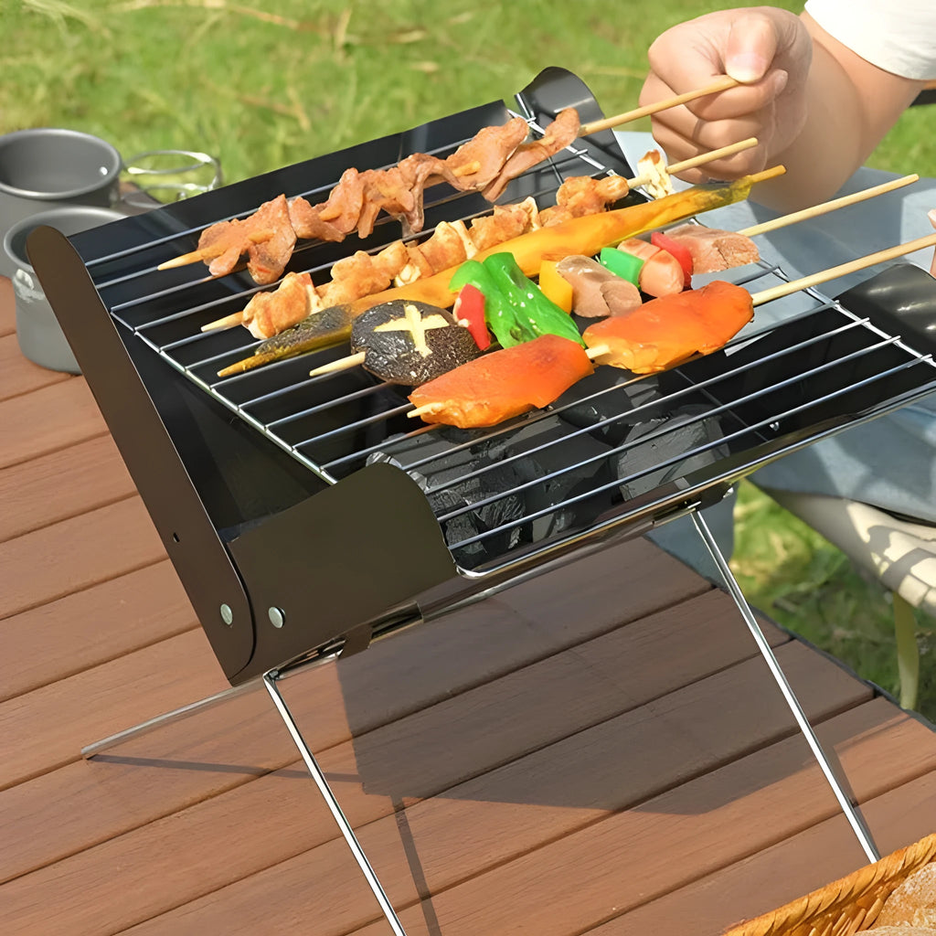 Portable black barbecue grill with grill rack, compact size 29x26x29cm for outdoor camping cooking