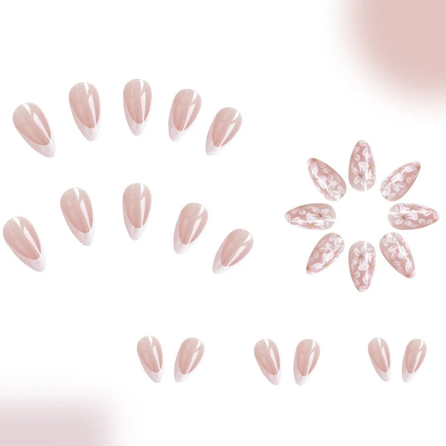 Short almond-shaped false nails with French style glitter and flower designs in colour C625