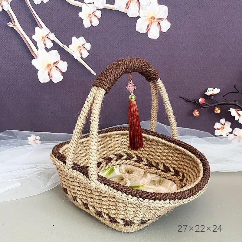 Small hand-woven straw storage basket in brown, measuring 19cm wide.