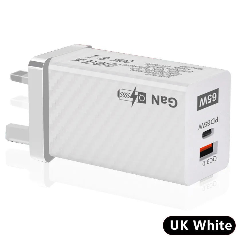 White and black 65W GaN USB-C laptop travel charger with UK, US, and EU plug options