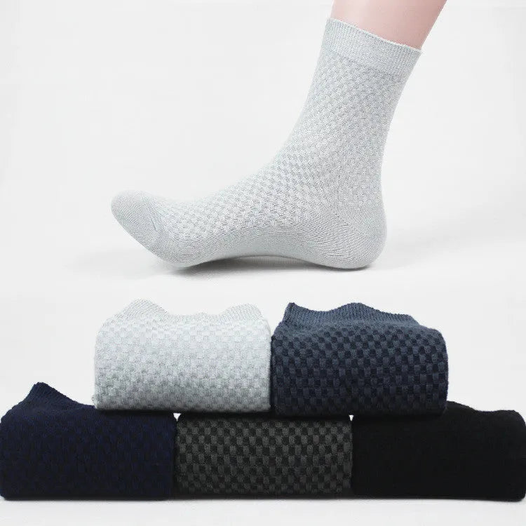 Pair of men's bamboo fibre business socks with small square pattern, shown in navy blue.