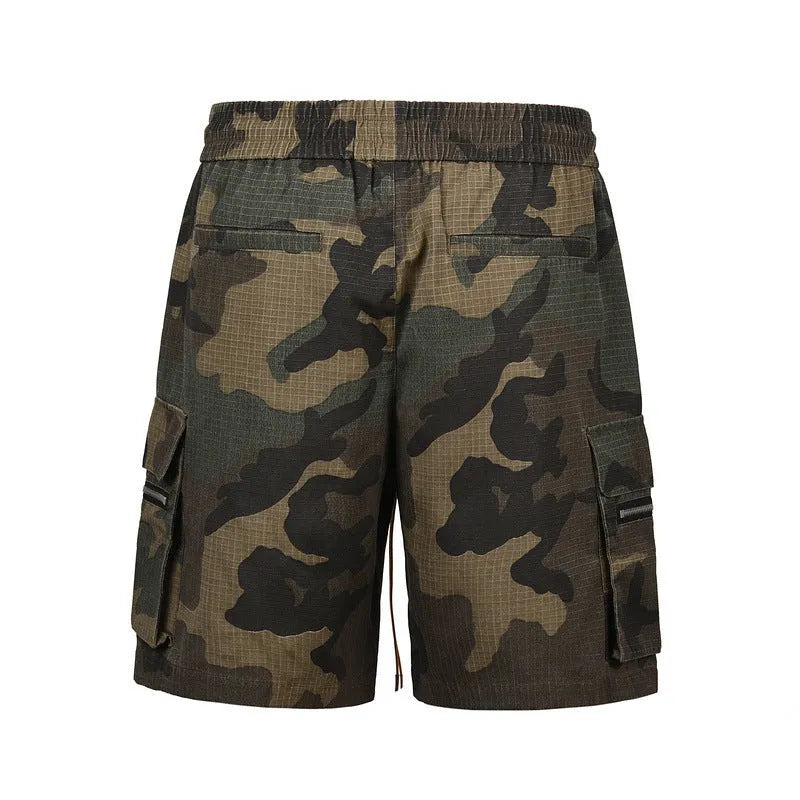 Man's green H215 camouflage cotton work shorts with multiple pockets shown in a loose fit.