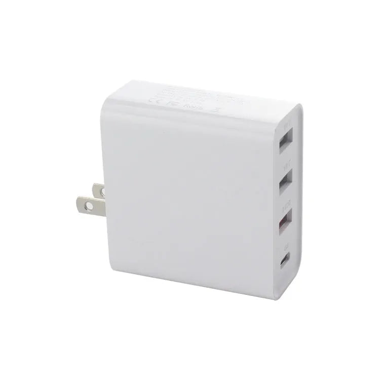 Black and white four-port USB-C wall charger with UK, US, EU, and AU plug options.