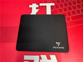 Black rubber gaming desk mat showing textured surface and 5mm thickness