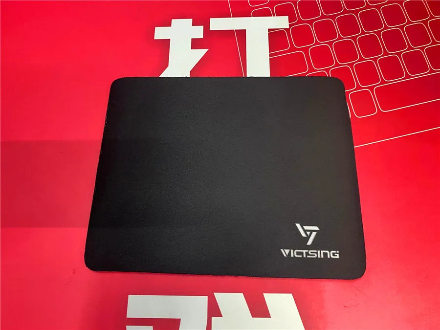 Black rubber gaming desk mat showing textured surface and 5mm thickness