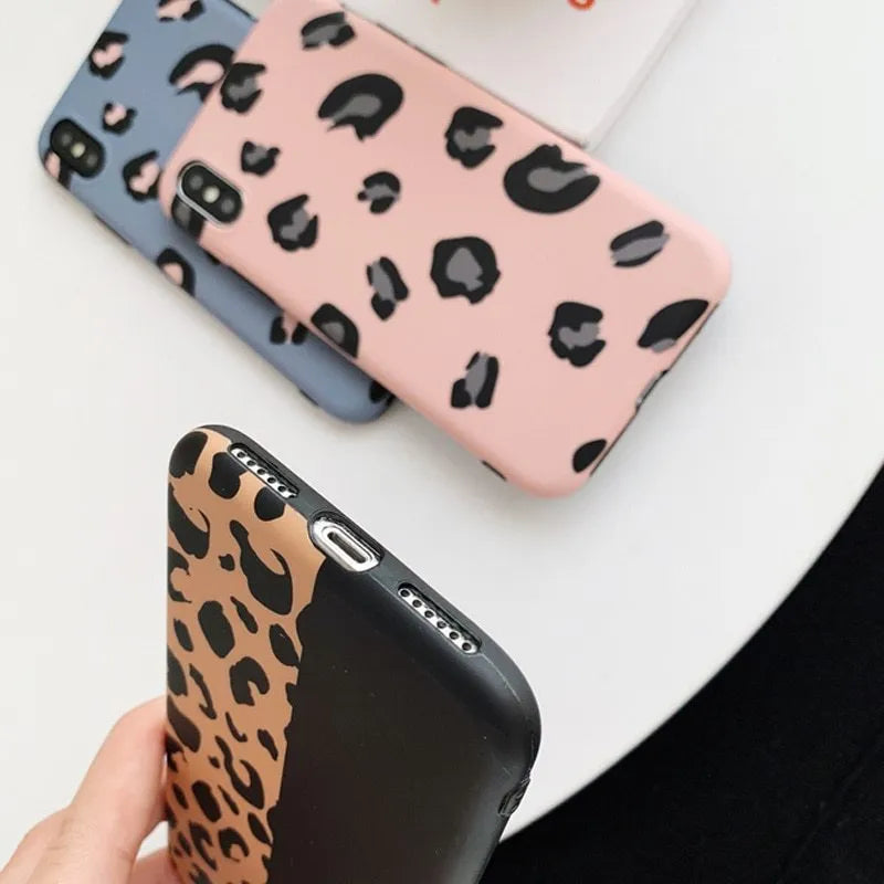 Leopard print phone case for iPhone in black, blue, and pink colours showing front and back views.