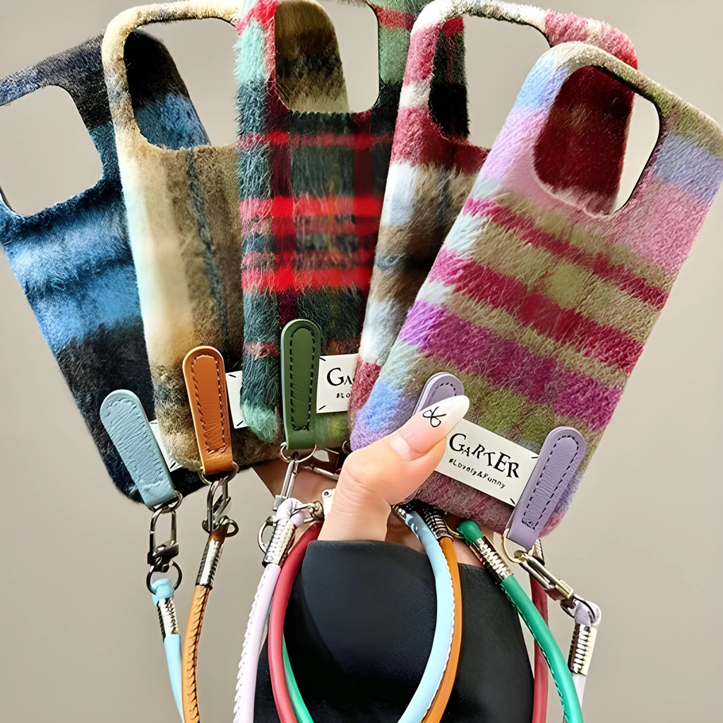 Flannel plaid phone case with wristband in black green and red checkered, compatible with iPhone models.