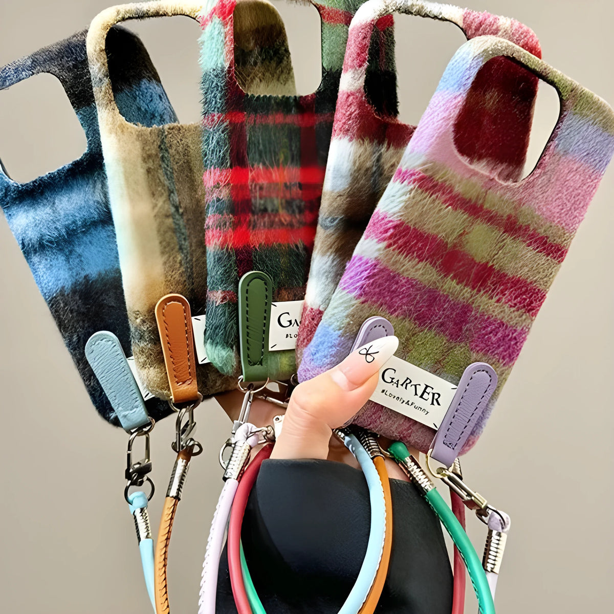 Flannel plaid phone case with wristband in black green and red checkered, compatible with iPhone models.
