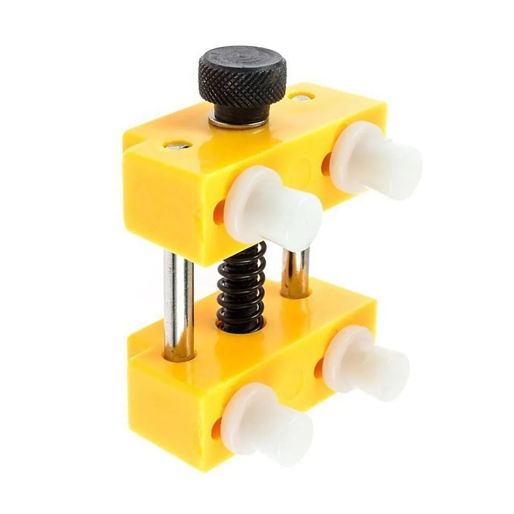 Yellow plastic watch fixing base and plastic case opener tool for watch repair.