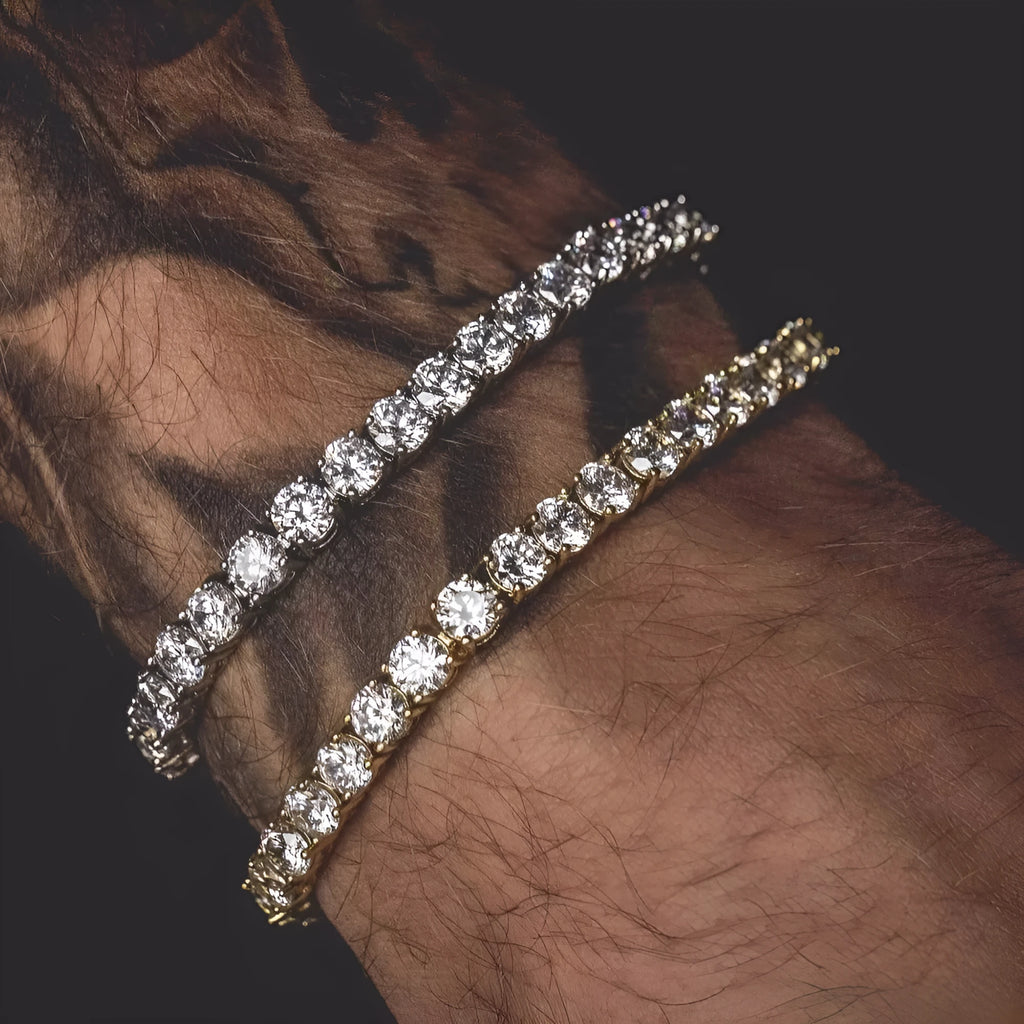 Men's silver geometric chain link bracelet with a row of sparkling clear rhinestones on a black background.