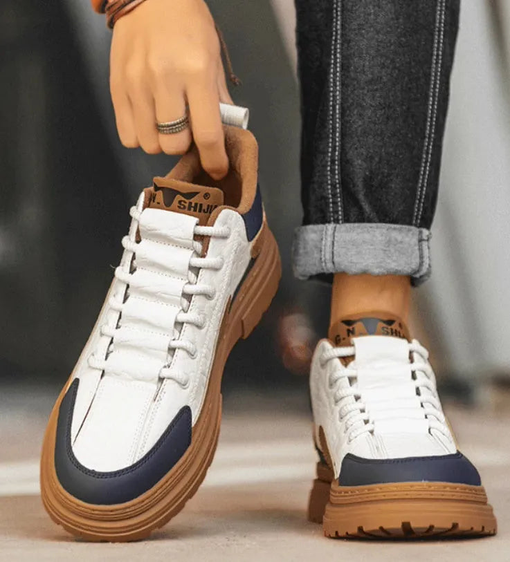 Black and white platform sneakers with thick rubber sole and microfiber leather insole.