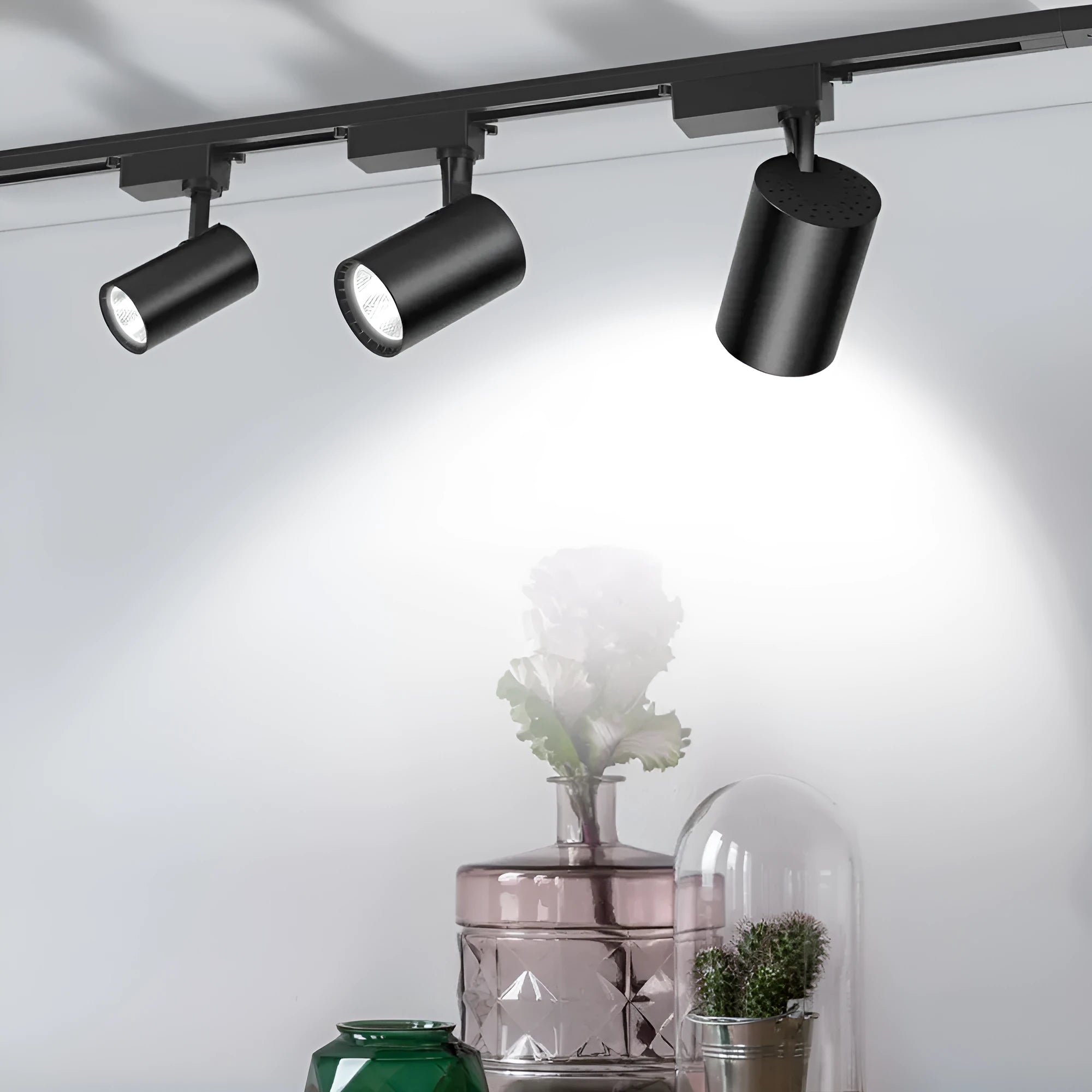 Black LED track spotlight with narrow beam angle for jewellery display lighting