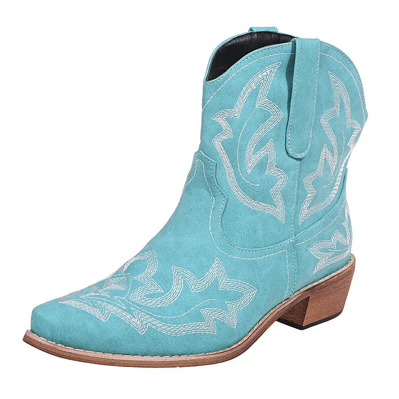 Women's embroidered cowboy boots with wedge heel in blue colour showing pointed toe and decorative stitching