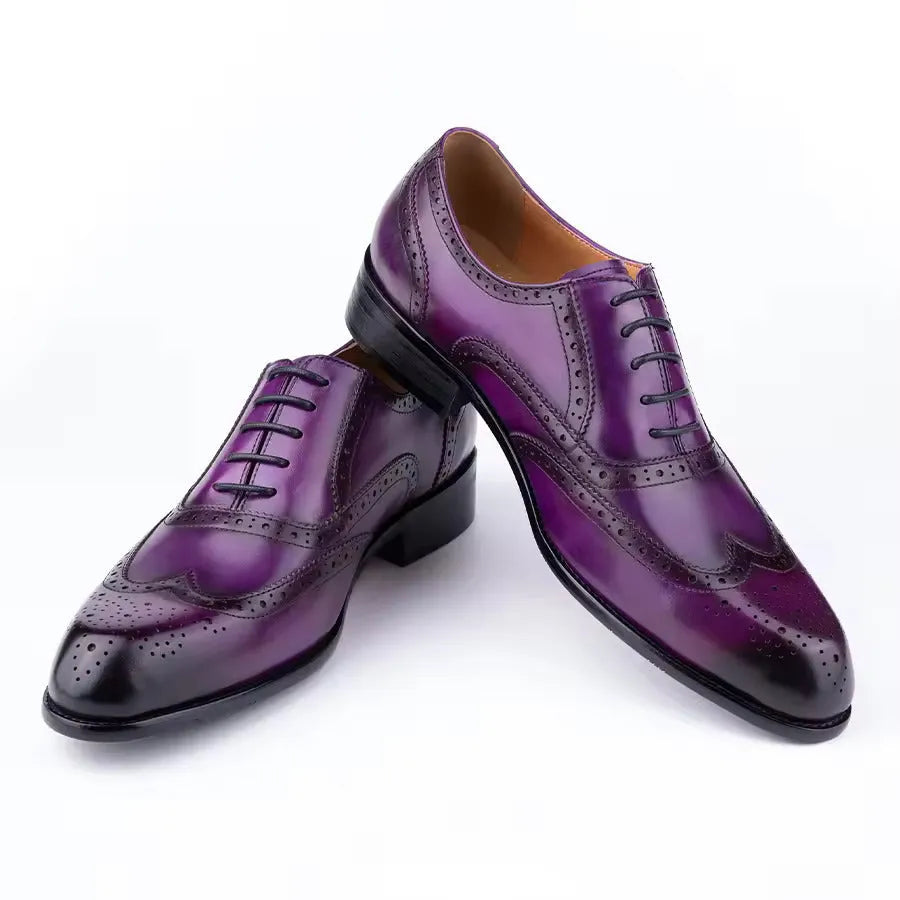 Purple men's Oxford shoes with hand-carved detailing and a pointed toe.