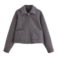 Women's gray PU jacket with shirt-collar, zip front, and long sleeves on a model