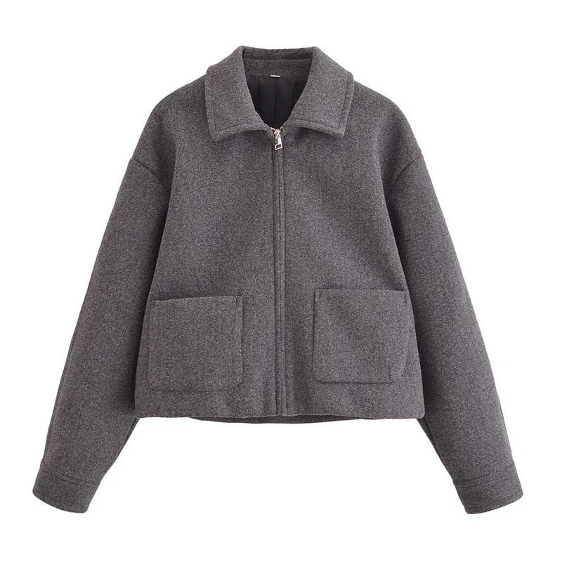 Women's gray PU jacket with shirt-collar, zip front, and long sleeves on a model