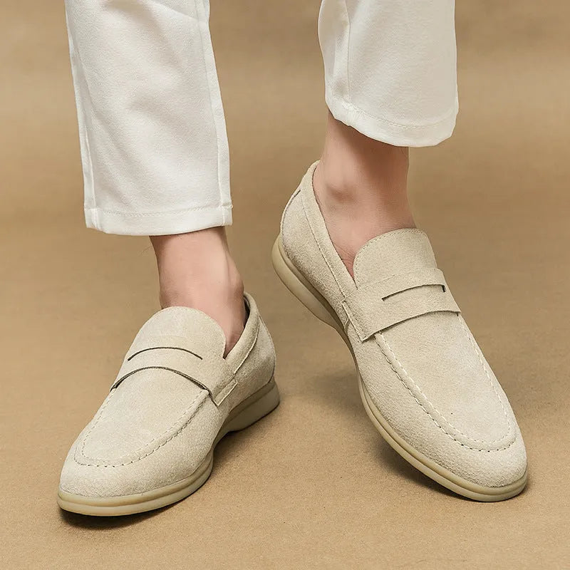 Men's black slip-on leather shoes with oversleeve design and rubber sole.