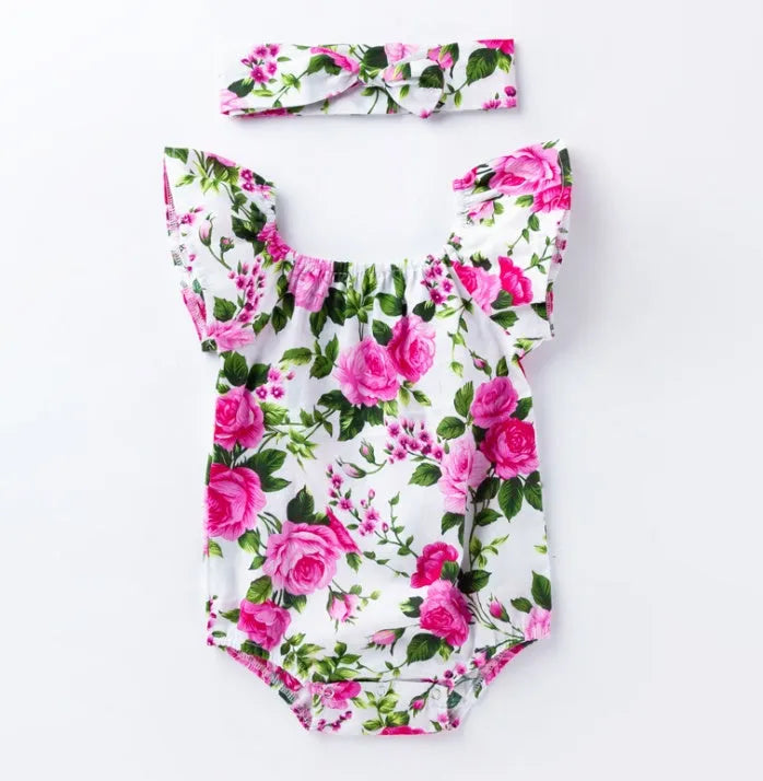 Black and white cotton baby girl romper with small flying sleeves and baby prints