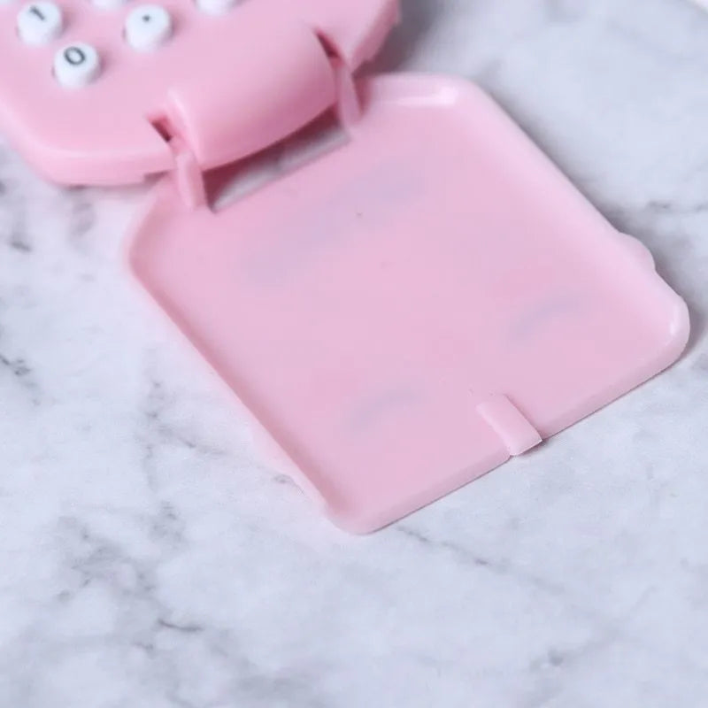 Creative cookie-shaped cute mini calculator with key ring in pink, blue, grey, and black colours