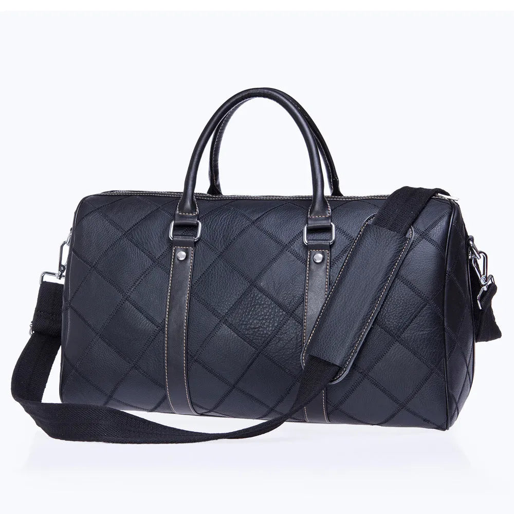 Vintage brown leather men's duffel bag with a single shoulder strap shown open to reveal internal organiser pockets.