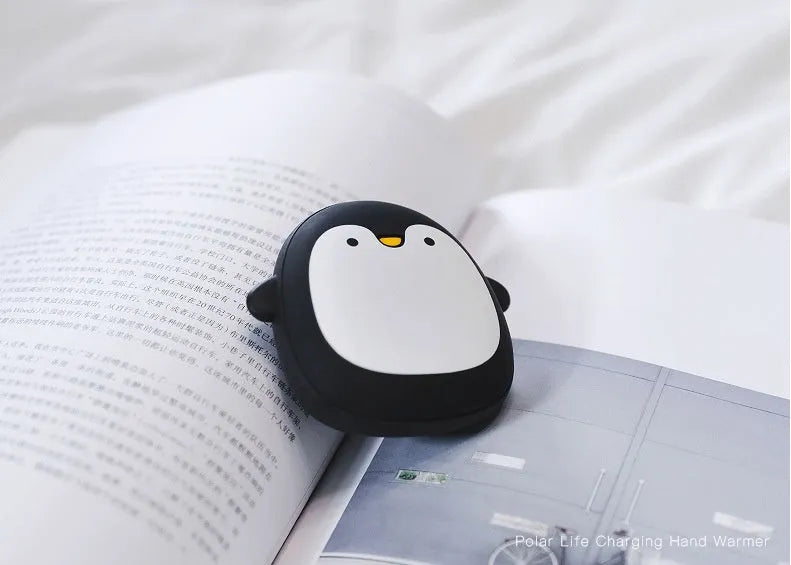 Cute cartoon penguin and polar bear design USB rechargeable hand warmer and power bank unit.